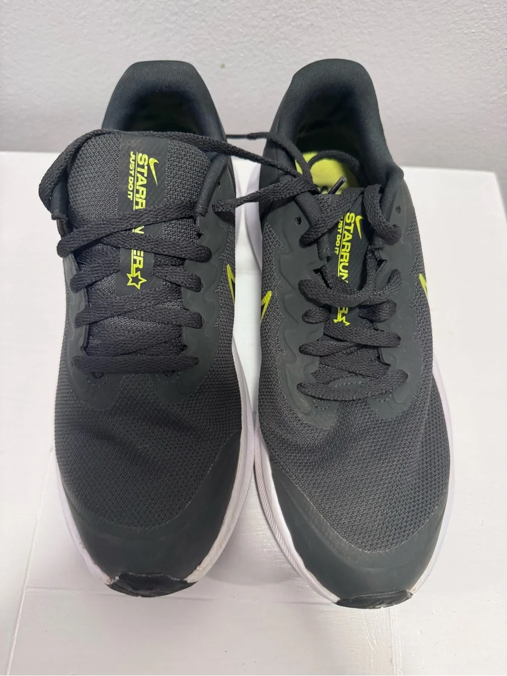 Nike Black Sneakers with Neon Yellow Swoosh and White Sole